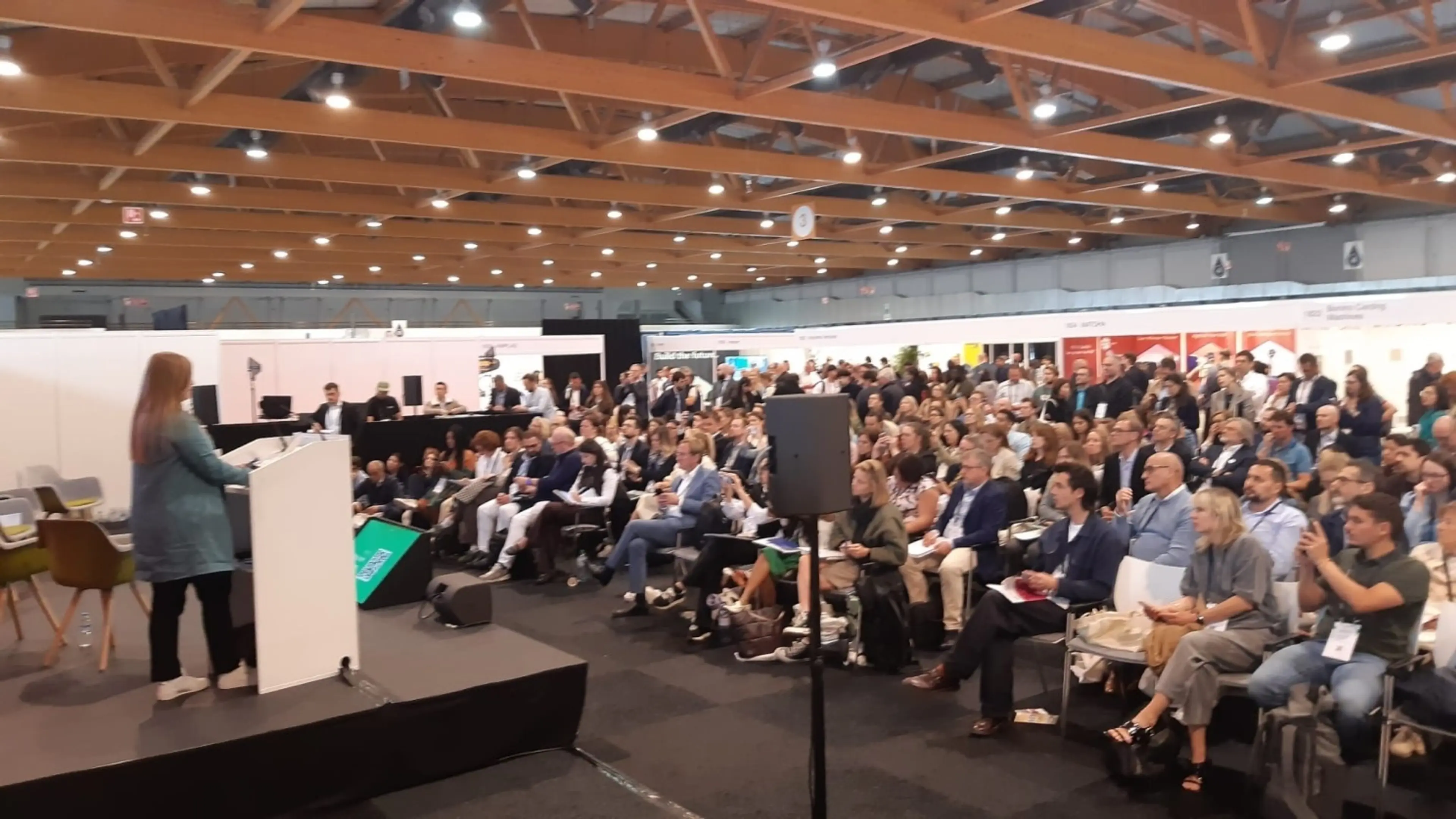 Olivia Poole presenting at AMI's Textiles Recycling Expo Europe 2025