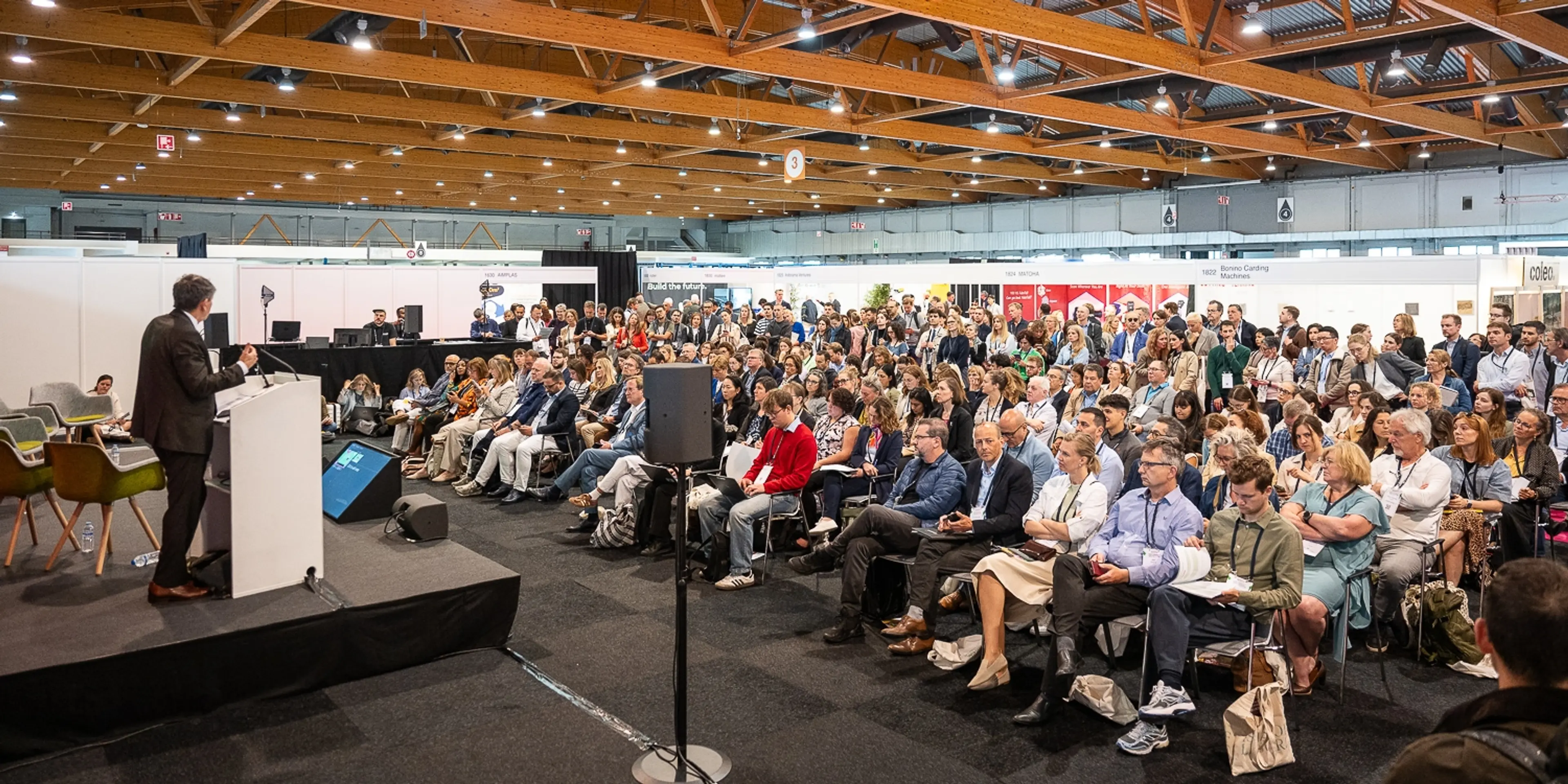 Busy theatre audience at Textiles Recycling Expo