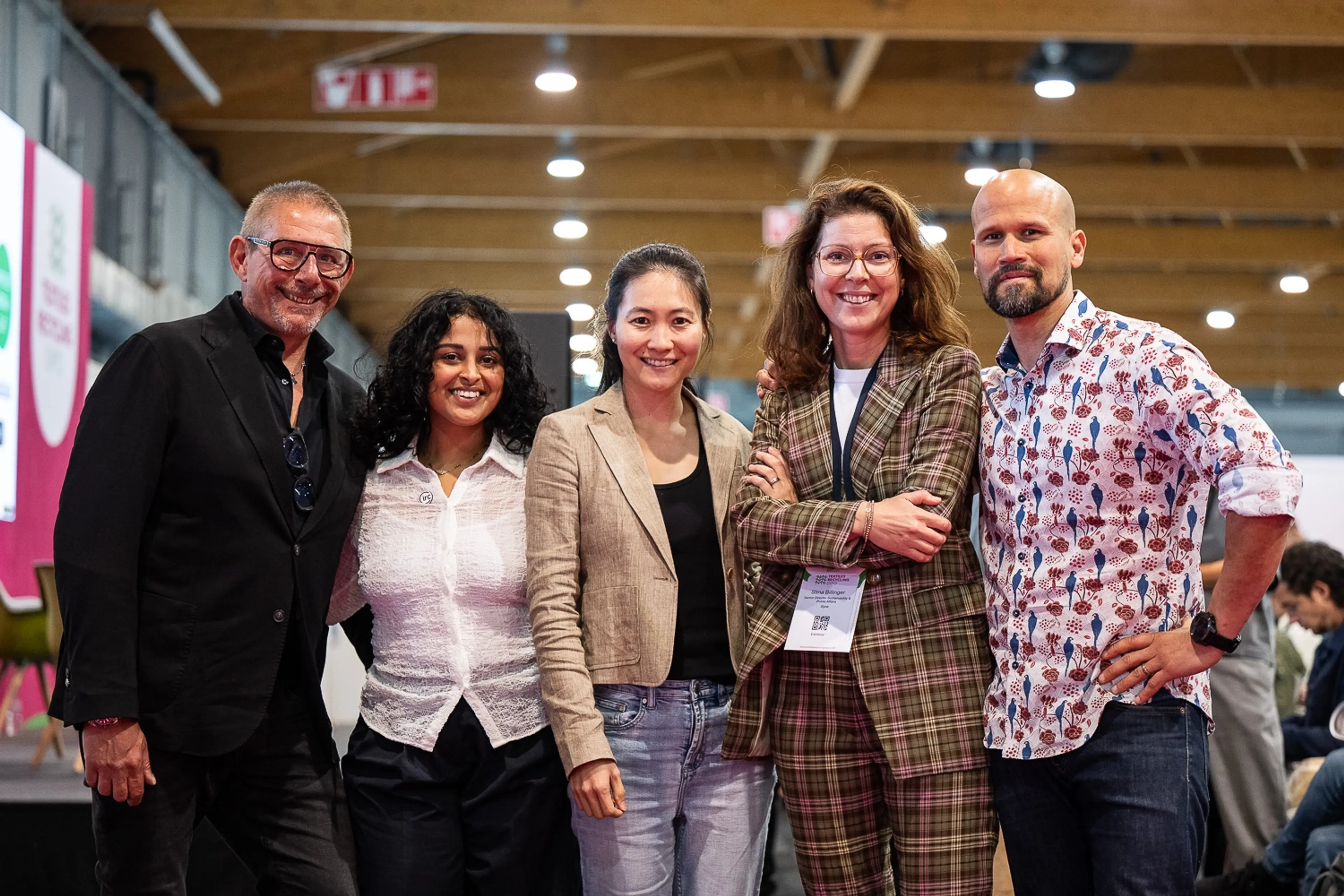 Smiling attendees at AMI's Textiles Recycling Expo Europe 2025